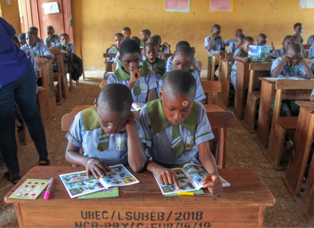 Pupils in a Hygiene Education Class using their Hygiene Quest comic book