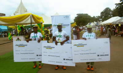 The winners pose with their checks