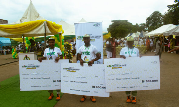 The winners pose with their checks
