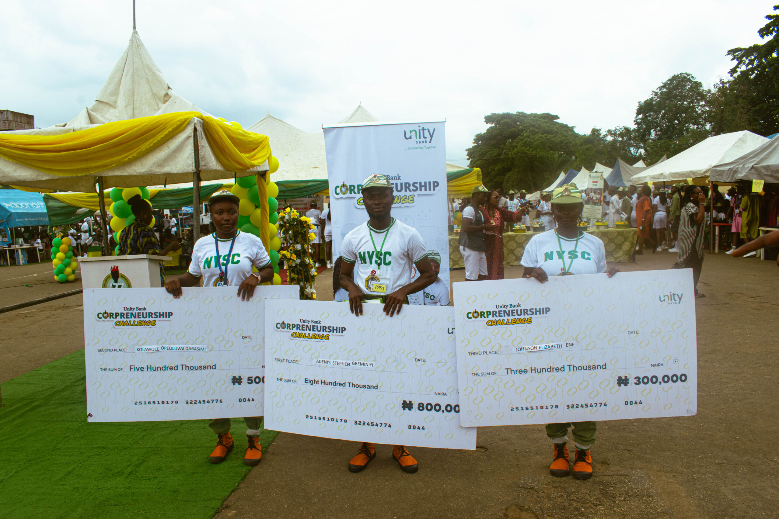 The winners pose with their checks