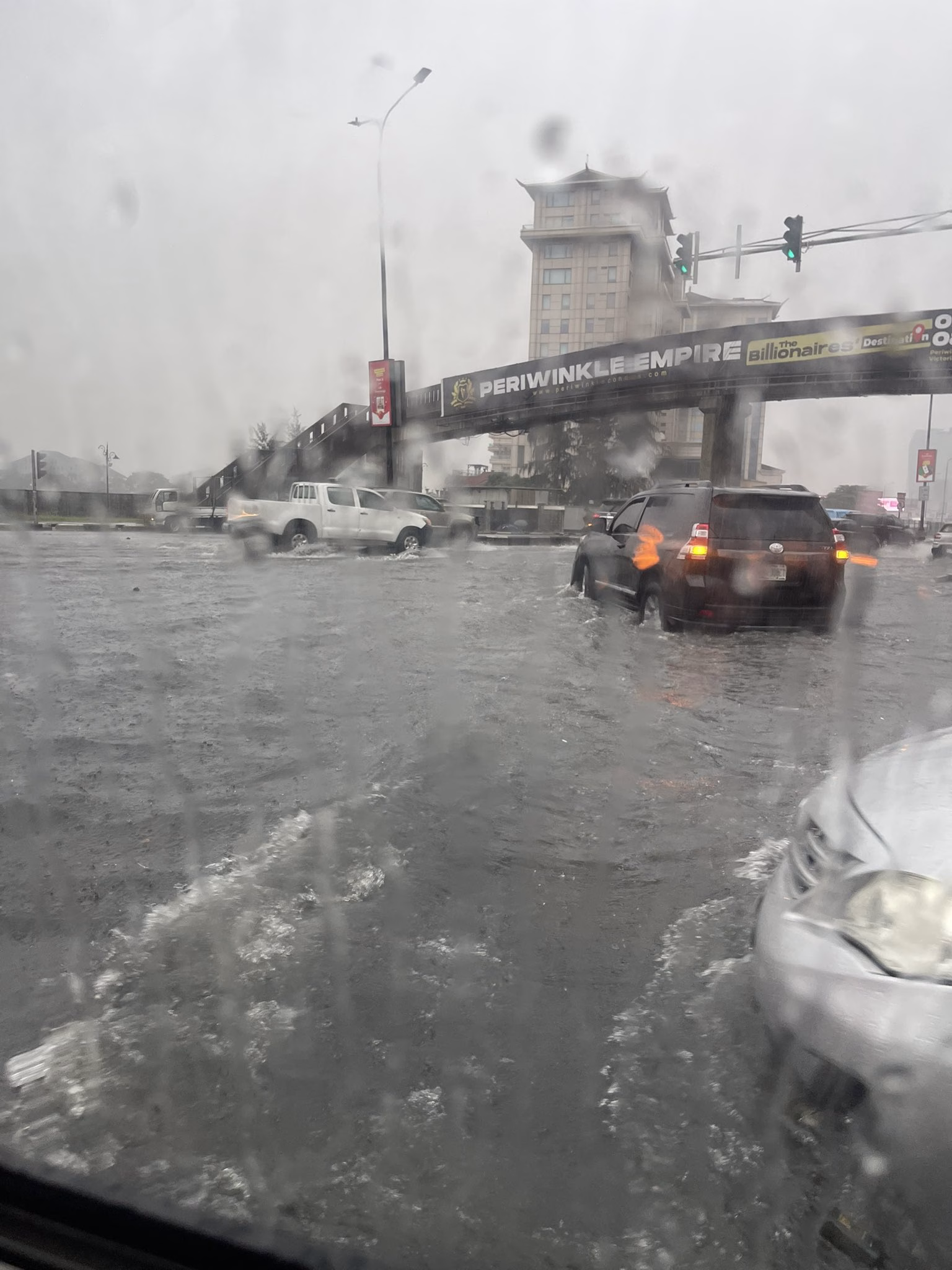 Heavy Rains Flood Lagos’ Lekki District, Submerge Luxury Cars and Disrupt Businesses