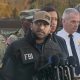The armed National Guardsmen were on patrols when the suspect came around the corner, raised his arm with a gun, and shot the National Guard members.