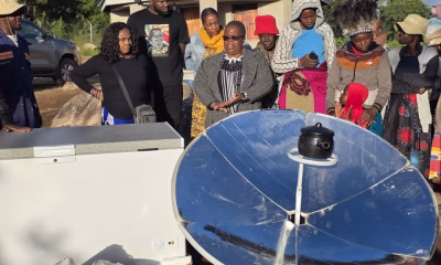 Dr-Mela-Chiponda-with-dark-spects-talks-to-women-during-the-presentation-of-a-solar-cooker-to-women-groups-in-Bikita-Zimbabwe.