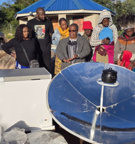 Dr-Mela-Chiponda-with-dark-spects-talks-to-women-during-the-presentation-of-a-solar-cooker-to-women-groups-in-Bikita-Zimbabwe.